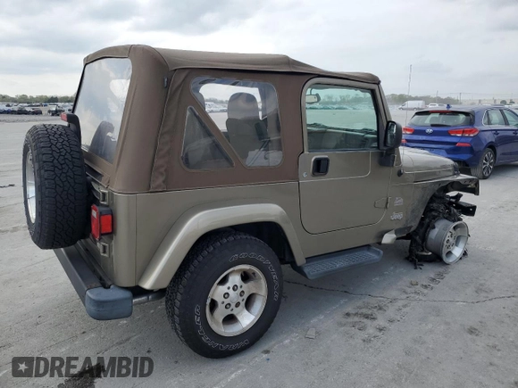 2003 Jeep Wrangler Sahara with VIN 1J4FA59S13P312830, listed as a Copart auction lot 52730955 with 99,247 mi miles and Salvage title. Bid and sale history available at DreamBid. Image 3.