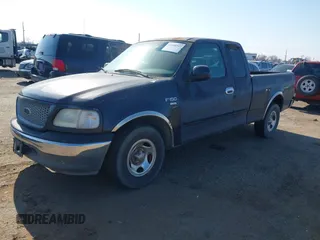 1999 Ford F-150 with VIN 2FTRX17L8XCB23329, listed as a IAAI auction lot 41448347 with 223,517 mi miles and . Bid and sale history available at DreamBid. Image 2.