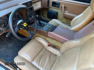 1988 Pontiac Fiero z VIN 1G2PE119XJP213392, wystawiony jako Copart lot #55215415 z przebiegiem 71 246 mil mil oraz Tytuł czysty. Historia ofert i sprzedaży dostępna na DreamBid. Obrazek 9.