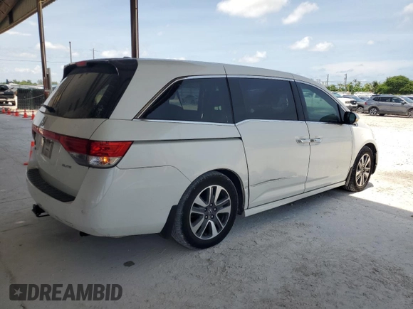 2014 Honda Odyssey Touring z VIN 5FNRL5H9XEB123330, wystawiony jako Copart lot #59023145 z przebiegiem 118 371 mil mil oraz Nie do naprawy • Non repairable. Historia ofert i sprzedaży dostępna na DreamBid. Obrazek 3.