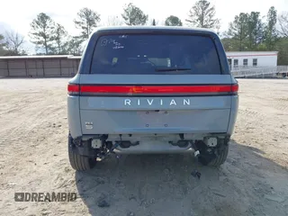 2024 Rivian R1S Adventure with VIN 7PDSGBBA1RN040036, listed as a IAAI auction lot 41694635 with 13,855 mi miles. Bid and sale history available at carsss.com. Image 6.