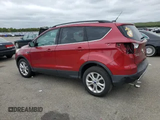 2018 Ford Escape SE z VIN 1FMCU9GD7JUB01668, wystawiony jako Copart lot #57038675 z przebiegiem 70 780 mil mil oraz Szkoda całkowita • Salvage title. Historia ofert i sprzedaży dostępna na DreamBid. Obrazek 2.