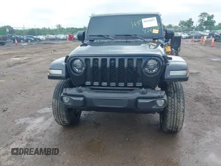 2023 Jeep Gladiator Overland with VIN 1C6JJTFM9PL593659, listed as a IAAI auction lot 42470253 with 34,374 mi miles and . Bid and sale history available at DreamBid. Image 19.