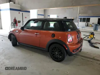 2013 MINI Hardtop S with VIN WMWSV3C52DT396176, listed as a Copart auction lot 59207165 with 104,194 mi miles and Salvage title. Bid and sale history available at DreamBid. Image 2.