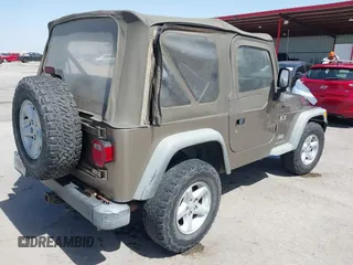 2003 Jeep Wrangler X with VIN 1J4FA39S03P312550, listed as a IAAI auction lot 41837150 with 127,239 mi miles and . Bid and sale history available at DreamBid. Image 4.