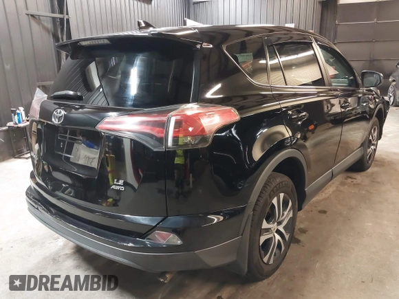 2018 Toyota RAV4 LE with VIN 2T3BFREV7JW768376, listed as a IAAI auction lot 41864571 with 292,147 mi miles. Bid and sale history available at carsss.com. Image 4.