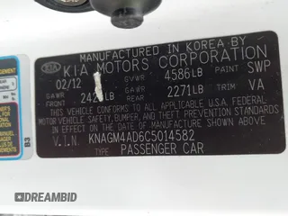2012 Kia Optima Hybrid with VIN KNAGM4AD6C5014582, listed as a IAAI auction lot 42186511 with 172,517 mi miles. Bid and sale history available at carsss.com. Image 9.