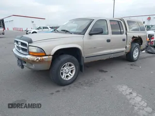 2002 Dodge Dakota SLT z VIN 1B7HG48N32S663205, wystawiony jako IAAI lot #41125874 z przebiegiem 186 761 mil mil oraz . Historia ofert i sprzedaży dostępna na DreamBid. Obrazek 2.