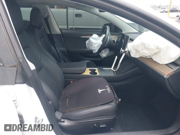 2023 Tesla Model 3 with VIN 5YJ3E1EA2PF417959, listed as a IAAI auction lot 42463853 with 22,736 mi miles and . Bid and sale history available at DreamBid. Image 5.
