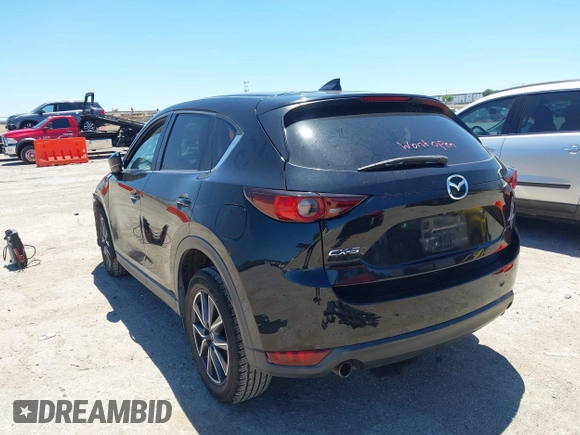 2018 Mazda CX-5 Touring z VIN JM3KFACM3J1339074, wystawiony jako IAAI lot #42317039 z przebiegiem 82 799 mil mil oraz . Historia ofert i sprzedaży dostępna na DreamBid. Obrazek 3.