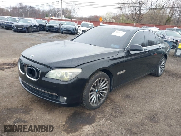 2011 BMW 7 Series 740i with VIN WBAKA4C55BC612584, listed as a IAAI auction lot 42021367 with 139,190 mi miles. Bid and sale history available at carsss.com. Image 2.