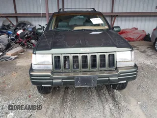 1997 Jeep Grand Cherokee Limited with VIN 1J4GZ78Y5VC723429, listed as a IAAI auction lot 42012836 with 231,126 mi miles. Bid and sale history available at carsss.com. Image 12.