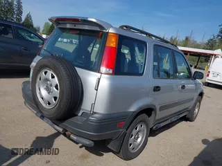 1999 Honda CR-V LX with VIN JHLRD1840XC057285, listed as a IAAI auction lot 42126071 with 99,000 mi miles. Bid and sale history available at carsss.com. Image 4.