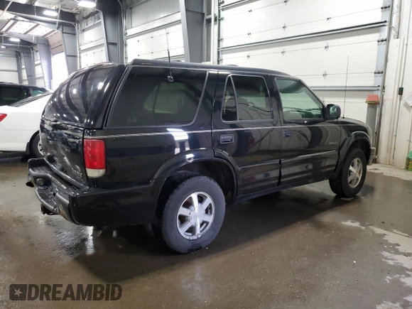 2001 Oldsmobile Bravada z VIN 1GHDT13W912194316, wystawiony jako Copart lot #49438485 z przebiegiem 124 380 mil mil oraz Szkody całkowita. Historia ofert i sprzedaży dostępna na DreamBid. Obrazek 3.