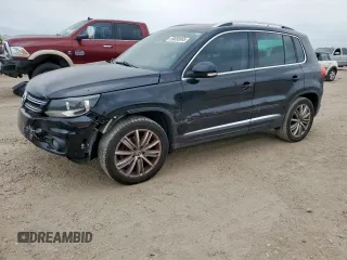 2012 Volkswagen Tiguan SE z VIN WVGAV7AX2CW575871, wystawiony jako Copart lot #58050865 z przebiegiem 96 569 mil mil oraz Szkody całkowita. Historia ofert i sprzedaży dostępna na DreamBid. Obrazek 1.