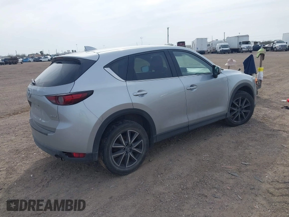 2017 Mazda CX-5 Grand Touring with VIN JM3KFBDL8H0227348, listed as a IAAI auction lot 41572377 with 124,908 mi miles. Bid and sale history available at carsss.com. Image 4.
