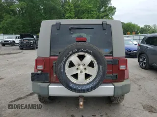 2008 Jeep Wrangler Unlimited Sahara z VIN 1J8GA59108L648333, wystawiony jako Copart lot #57430015 z przebiegiem 506 770 mil mil oraz Czysty tytuł • Clean title. Historia ofert i sprzedaży dostępna na DreamBid. Obrazek 6.