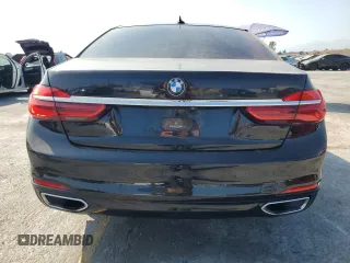 2017 BMW 7 Series 740i with VIN WBA7E2C50HG739565, listed as a Copart auction lot 64584885 with 114,496 mi miles and Salvage title. Bid and sale history available at DreamBid. Image 6.