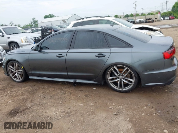 2016 Audi S6 Prestige z VIN WAUH2AFC1GN016187, wystawiony jako IAAI lot #42274744 z przebiegiem 169 821 mil mil oraz . Historia ofert i sprzedaży dostępna na DreamBid. Obrazek 14.