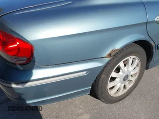 2004 Hyundai Sonata GLS with VIN KMHWF35H84A049046, listed as a IAAI auction lot 42071777 with 158,148 mi miles. Bid and sale history available at carsss.com. Image 16.