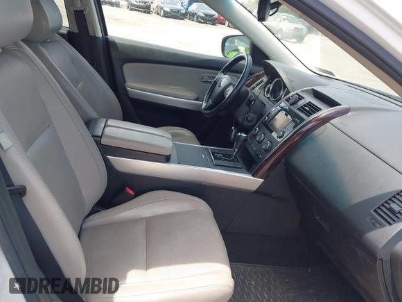 2014 Mazda CX-9 Grand Touring z VIN JM3TB3DV0E0436649, wystawiony jako IAAI lot #42319638 z przebiegiem 128 421 mil mil oraz . Historia ofert i sprzedaży dostępna na DreamBid. Obrazek 5.