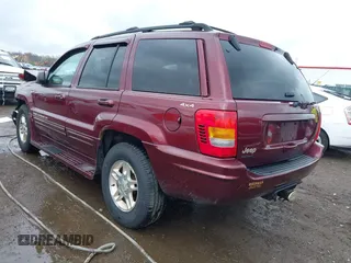 1999 Jeep Grand Cherokee Limited with VIN 1J4GW68N5XC642670, listed as a IAAI auction lot 41990199 with 154,492 mi miles. Bid and sale history available at carsss.com. Image 3.