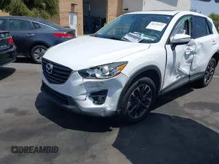 2016 Mazda CX-5 Grand Touring z VIN JM3KE2DY2G0824802, wystawiony jako IAAI lot #42170591 z przebiegiem 53 173 mil mil oraz . Historia ofert i sprzedaży dostępna na DreamBid. Obrazek 17.