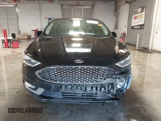 2017 Ford Fusion Titanium with VIN 3FA6P0SUXHR208653, listed as a IAAI auction lot 41312067 with 62,601 mi miles and . Bid and sale history available at DreamBid. Image 12.