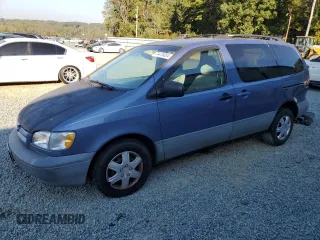 1999 Toyota Sienna LE with VIN 4T3ZF13C8XU108650, listed as a Copart auction lot 74476004 with 215,060 mi miles and Salvage Title. Bid and sale history available at carsss.com. Image 1.