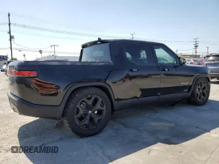2023 Rivian R1T Adventure z VIN 7FCTGBAA6PN029702, wystawiony jako Copart lot #49833425 z przebiegiem 6608 mil mil oraz Szkody całkowita. Historia ofert i sprzedaży dostępna na DreamBid. Obrazek 3.