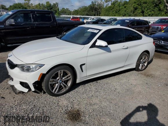 2014 BMW 4 Series 435i xDrive with VIN WBA3R5C59EK187836, listed as a Copart auction lot 63946075 with 100,700 mi miles and Salvage title. Bid and sale history available at DreamBid. Image 1.