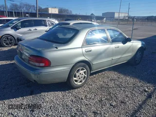 1999 Mazda 626 LX with VIN 1YVGF22DXX5847298, listed as a IAAI auction lot 41236165 with 194,445 mi miles. Bid and sale history available at carsss.com. Image 4.