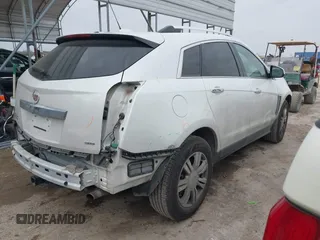 2015 Cadillac SRX Luxury Collection z VIN 3GYFNBE31FS552323, wystawiony jako IAAI lot #41553081 z przebiegiem 91 214 mil mil oraz . Historia ofert i sprzedaży dostępna na DreamBid. Obrazek 4.