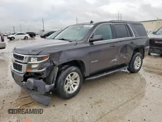 2015 Chevrolet Tahoe LS with VIN 1GNSCAKC4FR113247, listed as a Copart auction lot 55578085 with 194,023 mi miles and Salvage title. Bid and sale history available at DreamBid. Image 1.
