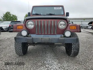 2001 Jeep Wrangler Sahara z VIN 1J4FA59SX1P305100, wystawiony jako Copart lot #58606685 z przebiegiem 76 856 mil mil oraz Czysty tytuł • Clean title. Historia ofert i sprzedaży dostępna na DreamBid. Obrazek 5.