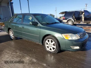 2001 Toyota Avalon XL z VIN 4T1BF28B81U162506, wystawiony jako Copart lot #52031805 z przebiegiem 212 437 mil mil oraz Szkody całkowita. Historia ofert i sprzedaży dostępna na DreamBid. Obrazek 4.