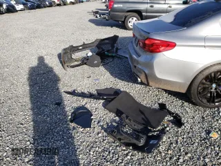 2018 BMW M5 z VIN WBSJF0C56JB282086, wystawiony jako Copart lot #37483454 z przebiegiem Nie podano mil oraz Szkoda całkowita • Salvage title. Historia ofert i sprzedaży dostępna na DreamBid. Obrazek 14.