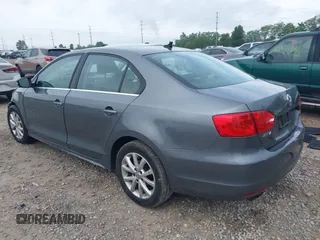 2013 Volkswagen Jetta SE with VIN 3VWDX7AJ7DM426720, listed as a IAAI auction lot 42366632 with 142,318 mi miles and . Bid and sale history available at DreamBid. Image 3.