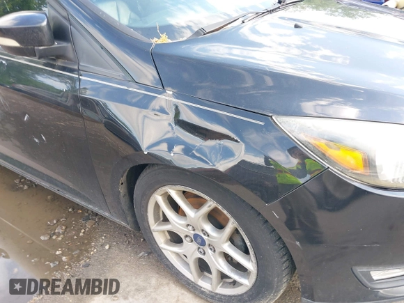 2015 Ford Focus SE with VIN 1FADP3K2XFL319559, listed as a IAAI auction lot 42205107 with 184,499 mi miles. Bid and sale history available at carsss.com. Image 15.
