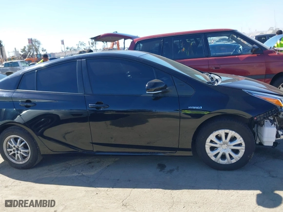 2021 Toyota Prius L Eco with VIN JTDKAMFU3M3148574, listed as a IAAI auction lot 41624303 with 89,747 mi miles. Bid and sale history available at carsss.com. Image 13.