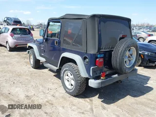 2000 Jeep Wrangler Sport with VIN 1J4FA49S7YP736479, listed as a IAAI auction lot 42042493 with 271,220 mi miles. Bid and sale history available at carsss.com. Image 3.