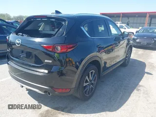 2018 Mazda CX-5 Grand Touring with VIN JM3KFADM2J1324547, listed as a IAAI auction lot 41947497 with 66,254 mi miles. Bid and sale history available at carsss.com. Image 4.