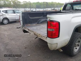 2014 GMC Sierra 1500 z VIN 1GTN1TEH0EZ352369, wystawiony jako IAAI lot #41982812 z przebiegiem 142 684 mil mil oraz . Historia ofert i sprzedaży dostępna na DreamBid. Obrazek 18.