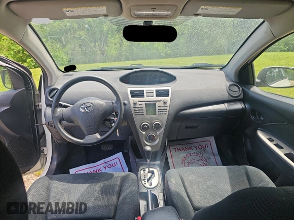 2009 Toyota Yaris z VIN JTDBT903991341371, wystawiony jako Copart lot #57634955 z przebiegiem 205 618 mil mil oraz Tytuł czysty. Historia ofert i sprzedaży dostępna na DreamBid. Obrazek 9.