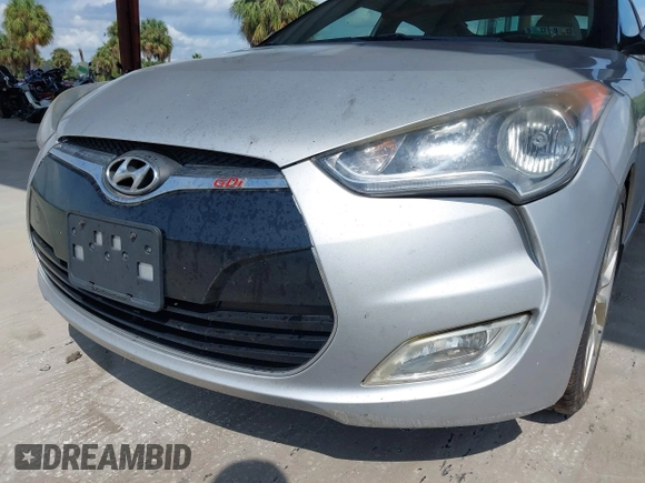 2012 Hyundai Veloster w/Gray Int z VIN KMHTC6ADXCU056898, wystawiony jako IAAI lot #40366687 z przebiegiem 137 161 mil mil oraz . Historia ofert i sprzedaży dostępna na DreamBid. Obrazek 6.
