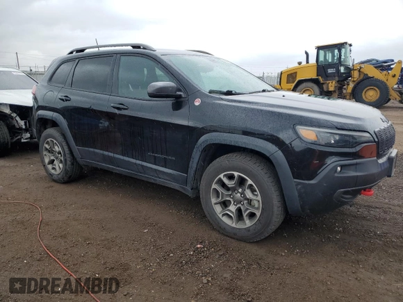 2020 Jeep Cherokee Trailhawk with VIN 1C4PJMBX2LD588381, listed as a Copart auction lot 56067055 with 82,467 mi miles and Salvage title. Bid and sale history available at DreamBid. Image 4.