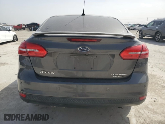 2016 Ford Focus Titanium with VIN 1FADP3J20GL274263, listed as a Copart auction lot 48340175 with 114,941 mi miles and Salvage title. Bid and sale history available at DreamBid. Image 6.