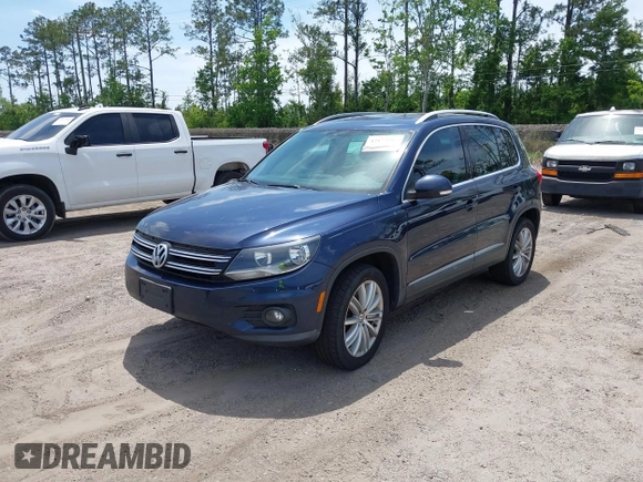 2012 Volkswagen Tiguan SEL with VIN WVGAV7AX7CW608637, listed as a IAAI auction lot 42173987 with 149,013 mi miles and . Bid and sale history available at DreamBid. Image 2.