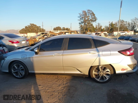 2018 Honda Clarity with VIN JHMZC5F15JC018312, listed as a IAAI auction lot 41354648 with 97,035 mi miles and . Bid and sale history available at DreamBid. Image 14.