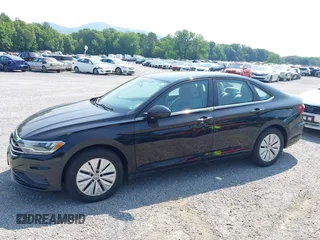 2019 Volkswagen Jetta S z VIN 3VWC57BU6KM084104, wystawiony jako IAAI lot #42423409 z przebiegiem 115 398 mil mil oraz . Historia ofert i sprzedaży dostępna na DreamBid. Obrazek 6.